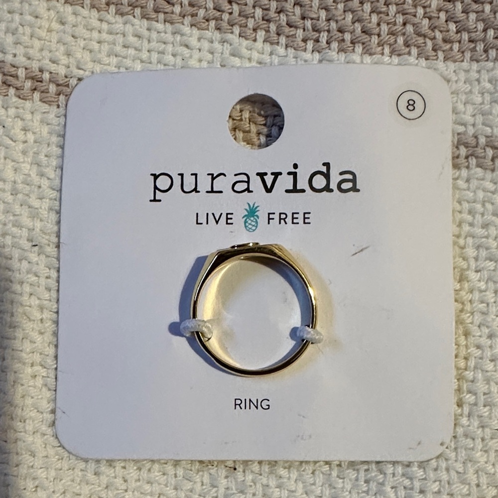 Putravida gold tone ring.  Size 8. Brand new